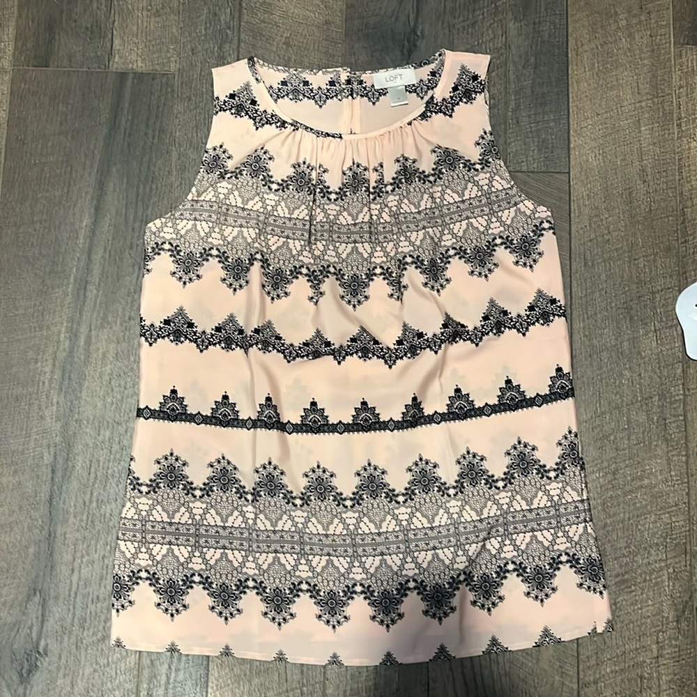 Woman’s small polyester sleeveless blouse